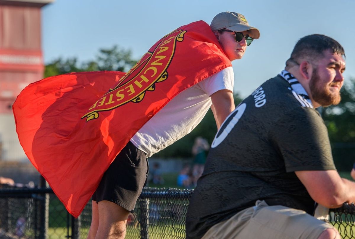 Justin Hart of Morton, a member of The 309 soccer fan club, sports a Manchester United F.C. flag as he watches the Peoria City USL 2 team battle the Des Moines Menace on Wednesday, June 22, 2022 at Shea Stadium in Peoria. Manchester United is a popular soccer team in the top-tier English Premier League.