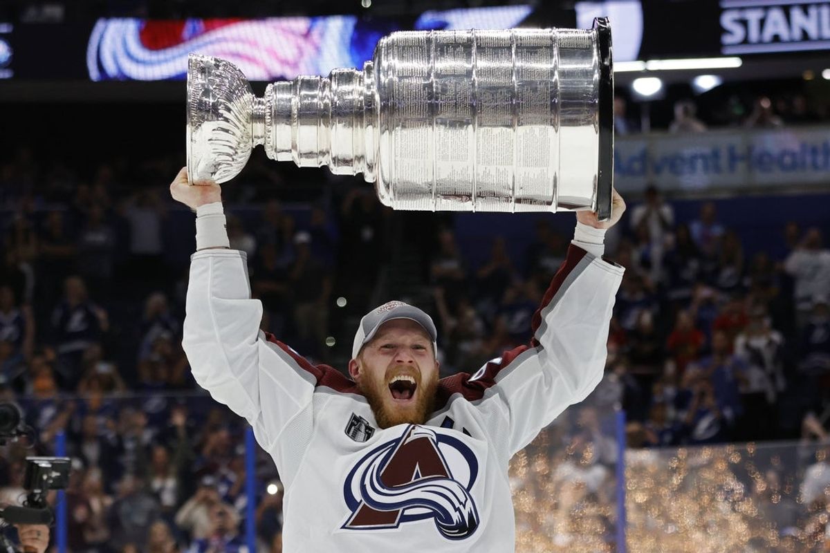 Jun 26, 2022; Tampa, Florida, USA; Colorado Avalanche left wing Gabriel Landeskog (92) celebrates with the Stanley Cup after the game against the Tampa Bay Lightning in game six of the 2022 Stanley Cup Final at Amalie Arena. Mandatory Credit: Geoff Burke-Imagn Images