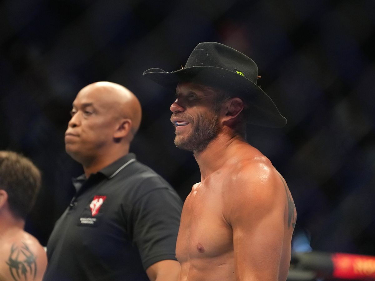 Jul 2, 2022; Las Vegas, Nevada, USA; Donald Cerrone (blue gloves) reacts after a loss to Jim Miller (red gloves) during UFC 276 at T-Mobile Arena. Mandatory Credit: Stephen R. Sylvanie-Imagn Images