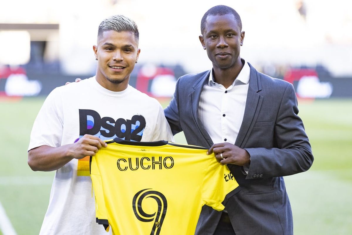 Jul 3, 2022; Columbus, Ohio, USA; Columbus Crew designated player Cucho (9) is introduced by assistant general manager Issa Tall prior to the match against Philadelphia Union at Lower.com Field. Mandatory Credit: Greg Bartram-USA TODAY Sports
