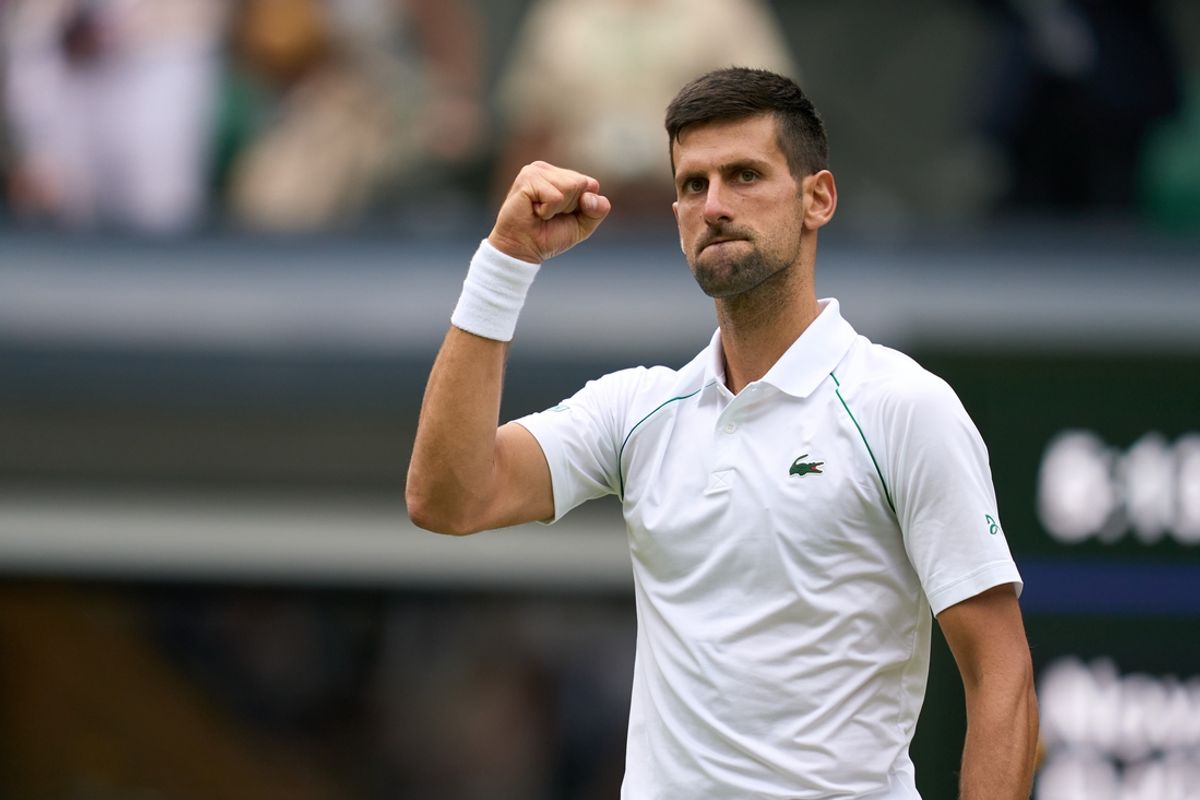 Novak Djokovic celebrates after match point against Jannik Sinner during a quarterfinals mens singles match on Centre court at the 2022 Wimbledon Championships at All England Lawn Tennis and Croquet Club. Mandatory Credit: Peter van den Berg-Imagn Images