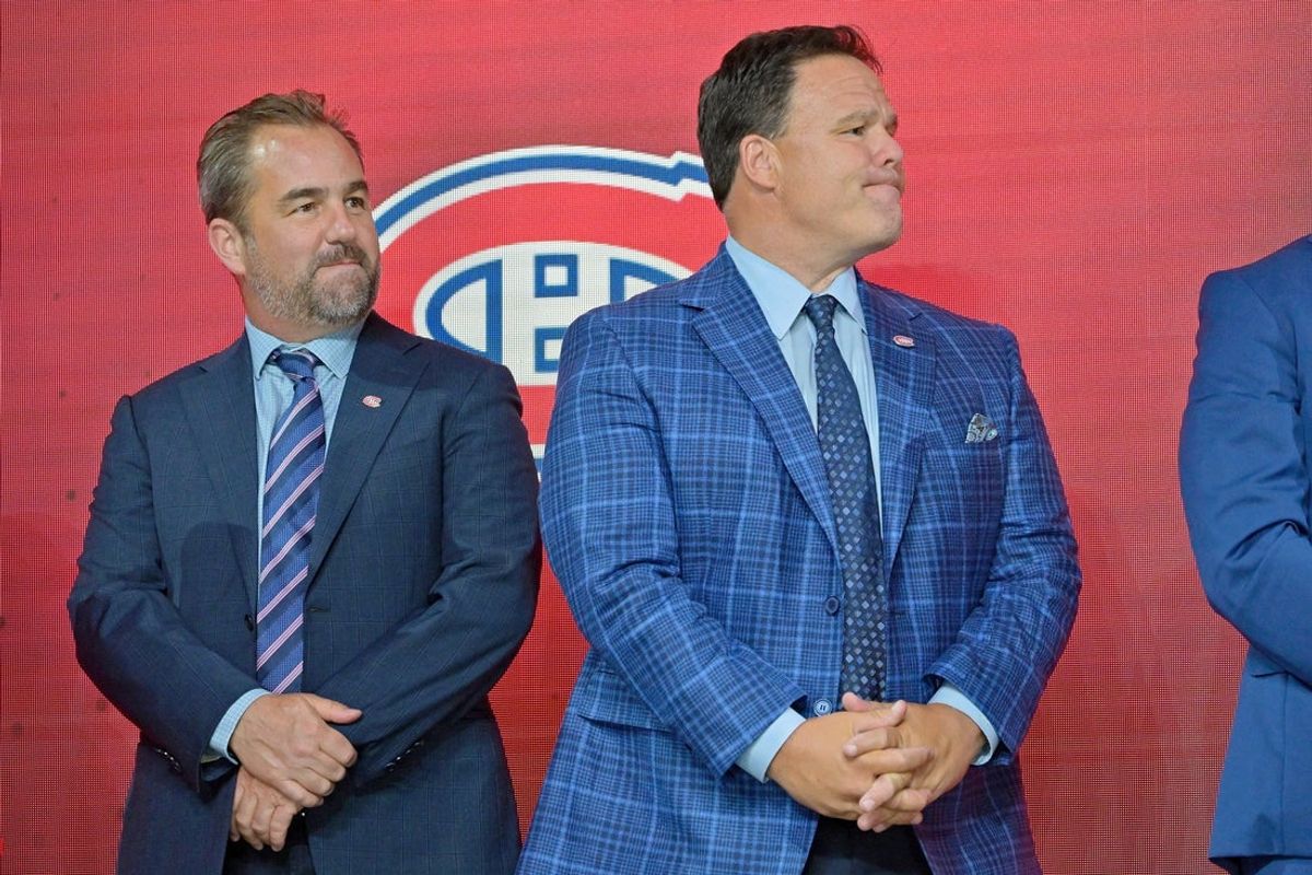 Jul 7, 2022; Montreal, Quebec, CANADA; Montreal Canadiens owner Geoff Molson (left) and executive vice president of hockey operations Jeff Gorton (right) look on before Filip Mesar (not pictured) is selected as the number twenty-six overall pick to the Montreal Canadiens in the first round of the 2022 NHL Draft at Bell Centre. Mandatory Credit: Eric Bolte-Imagn Images