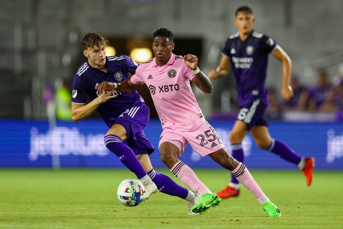 Jul 9, 2022; Orlando, Florida, USA;  Orlando City defender Michael Halliday (26) and Inter Miami midfielder Emerson Rodriguez (25) battle for the ball in the second half at Exploria Stadium. Mandatory Credit: Nathan Ray Seebeck-USA TODAY Sports