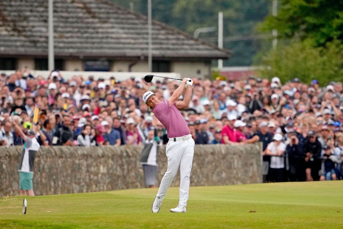 Jul 17, 2022; St. Andrews, SCT; Cameron Smith tees off on the 18th hole during the final round of the 150th Open Championship golf tournament at St. Andrews Old Course. Mandatory Credit: Michael Madrid-Imagn Images