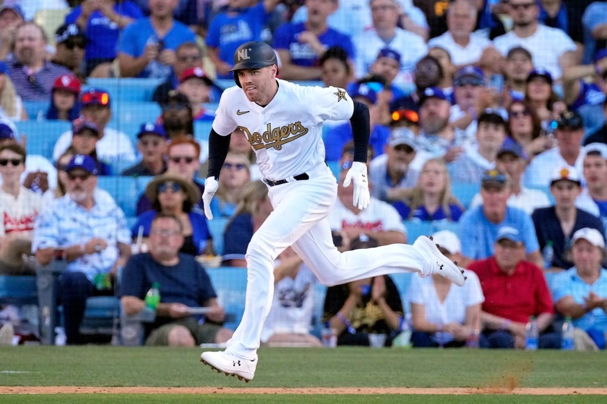 Jul 19, 2022; Los Angeles, California, USA; National League first baseman Freddie Freeman (5) of the Los Angeles Dodgers runs to first base as he grounds out against the American League during the third inning of the 2022 MLB All Star Game at Dodger Stadium. Mandatory Credit: Robert Hanashiro-Imagn Images