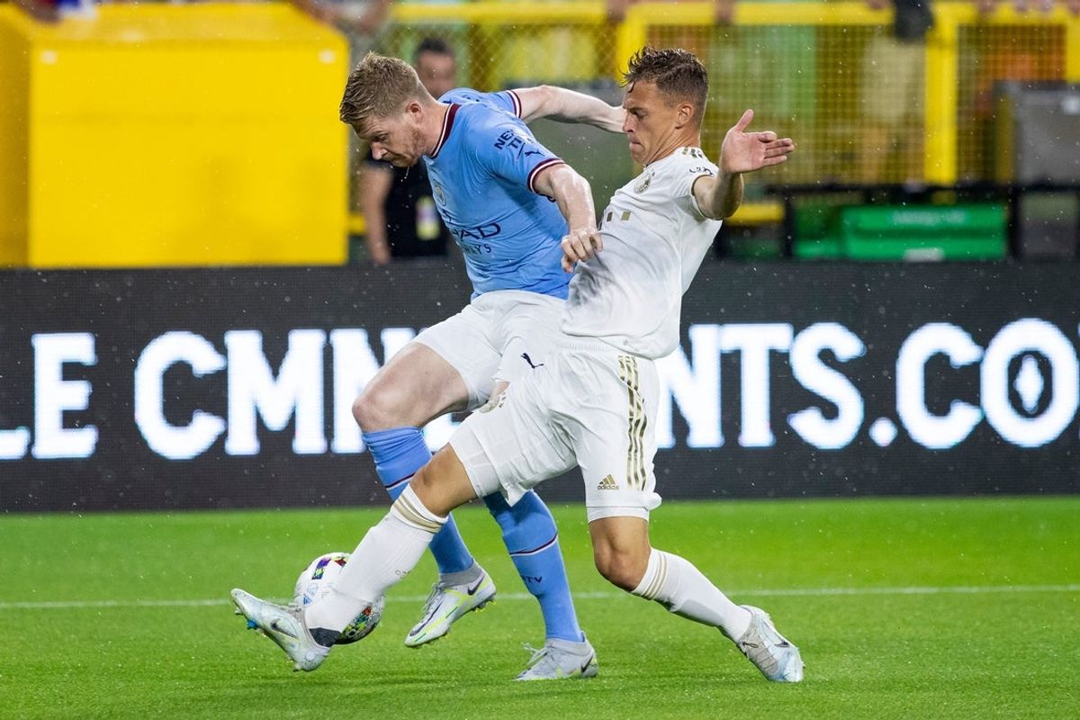 Manchester City midfielder Kevin De Bruyne (17) and FC Bayern Munich midfielder Joshua Kimmich (6) fight for the ball during the exhibition match on Saturday, July 23, 2022, at Lambeau Field in Green Bay, Wis.

Gpg Bayern Man City Match 7232022 0012