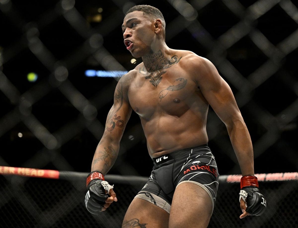 Jul 30, 2022; Dallas, TX, USA; Michael Morales (red gloves) celebrates after defeating Adam Fugitt (not pictured) in a welterweight bout during UFC 277 at the American Airlines Center. Mandatory Credit: Jerome Miron-Imagn Images