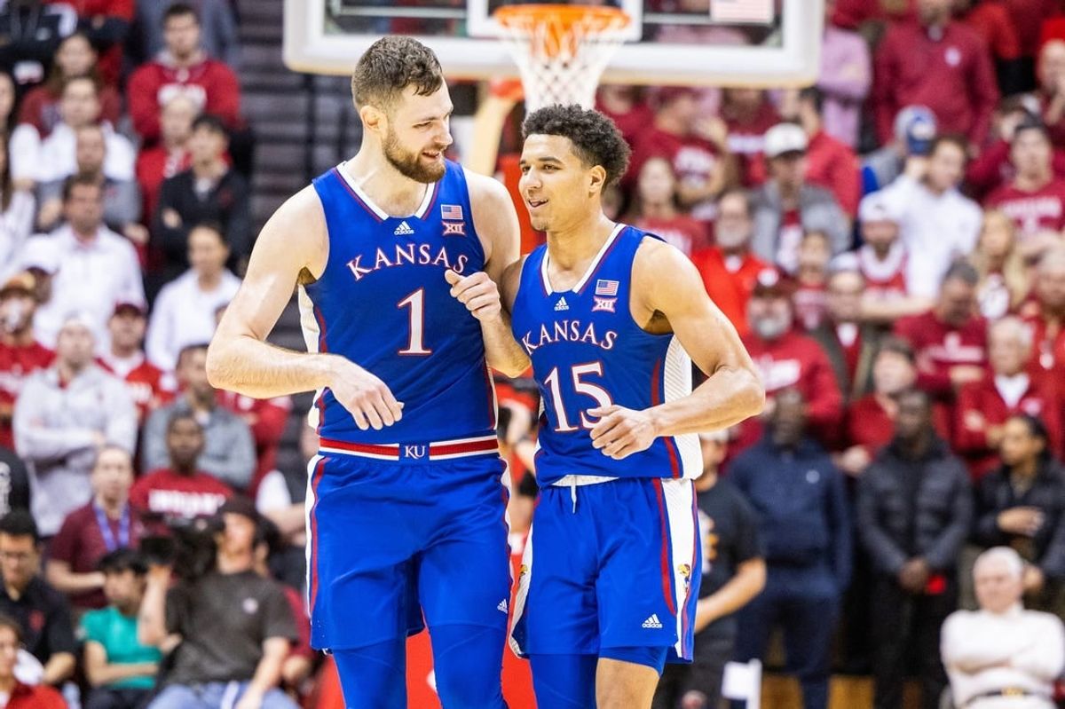 Dec 16, 2023; Bloomington, Indiana, USA; Kansas Jayhawks center Hunter Dickinson (1) and  guard Kevin McCullar Jr. (15) celebrate in the second half against the Indiana Hoosiers at Simon Skjodt Assembly Hall.