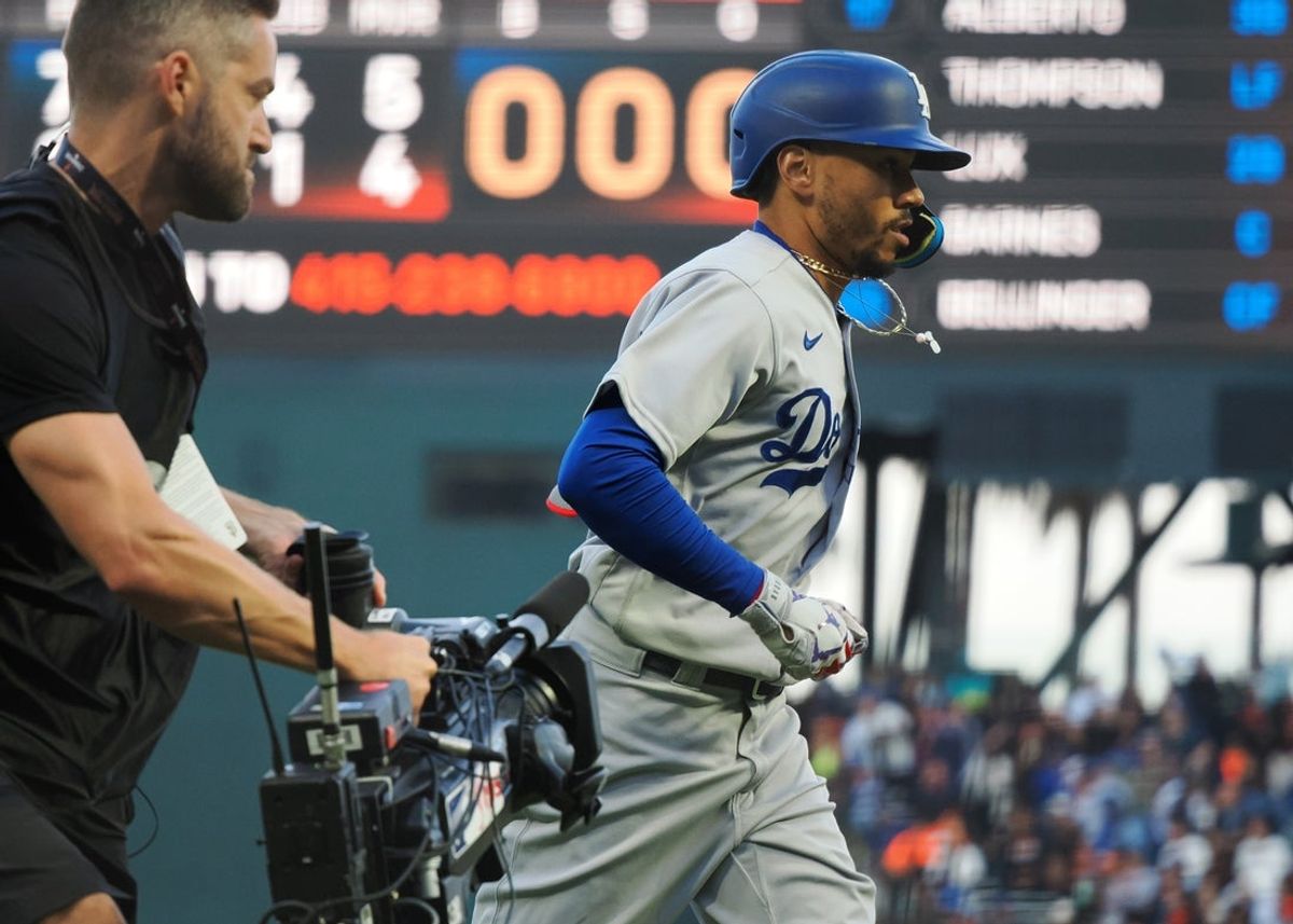 Aug 2, 2022; San Francisco, California, USA; Los Angeles Dodgers right fielder Mookie Betts (50) is followed by a television camera as he rounds the bases on a solo home run against the San Francisco Giants during the fourth inning at Oracle Park. Mandatory Credit: Kelley L Cox-Imagn Images