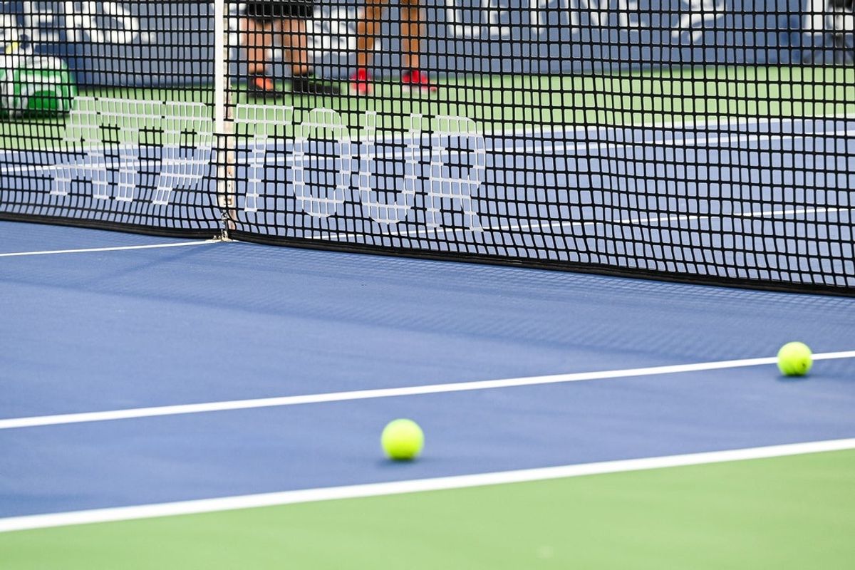 Aug 8, 2022; Montreal, Quebec, Canada; View of an ATP Tour logo on a net on central court before first round play at IGA Stadium. Mandatory Credit: David Kirouac-Imagn Images
