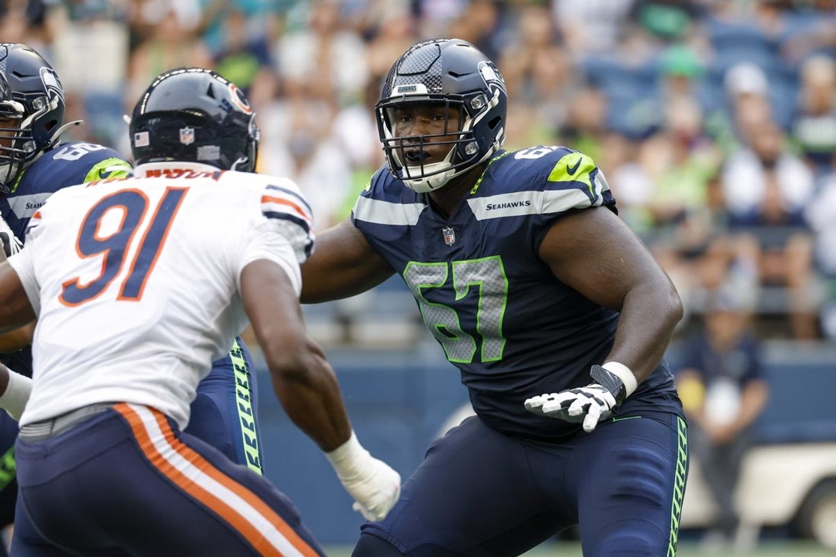 Aug 18, 2022; Seattle, Washington, USA; Seattle Seahawks offensive tackle Charles Cross (67) blocks against the Chicago Bears during the second quarter at Lumen Field. Mandatory Credit: Joe Nicholson-Imagn Images