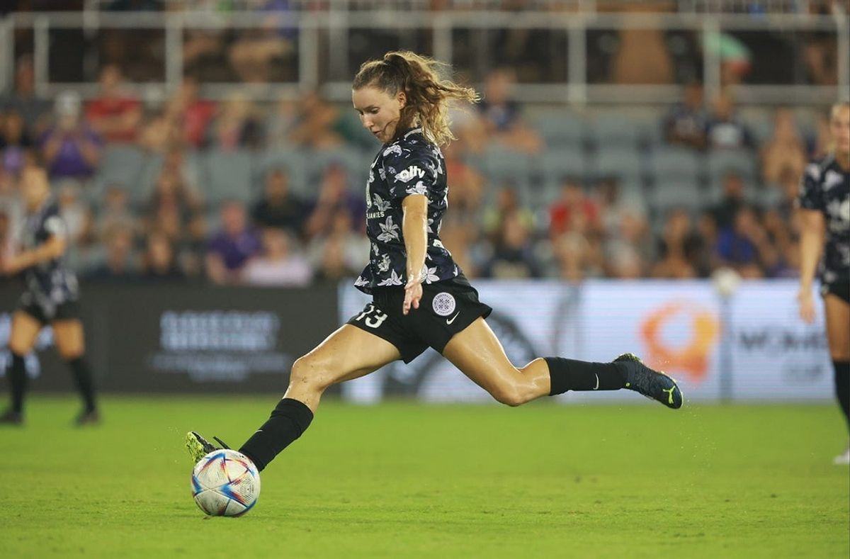 Aug 20, 2022; Louisville, Kentucky, USA; Racing Louisville FC forward Emina Ekic (13) takes a shot against the OL Reign in the Women's Cup championship match at Lynn Family Stadium. Mandatory Credit: EM Dash-Imagn Images