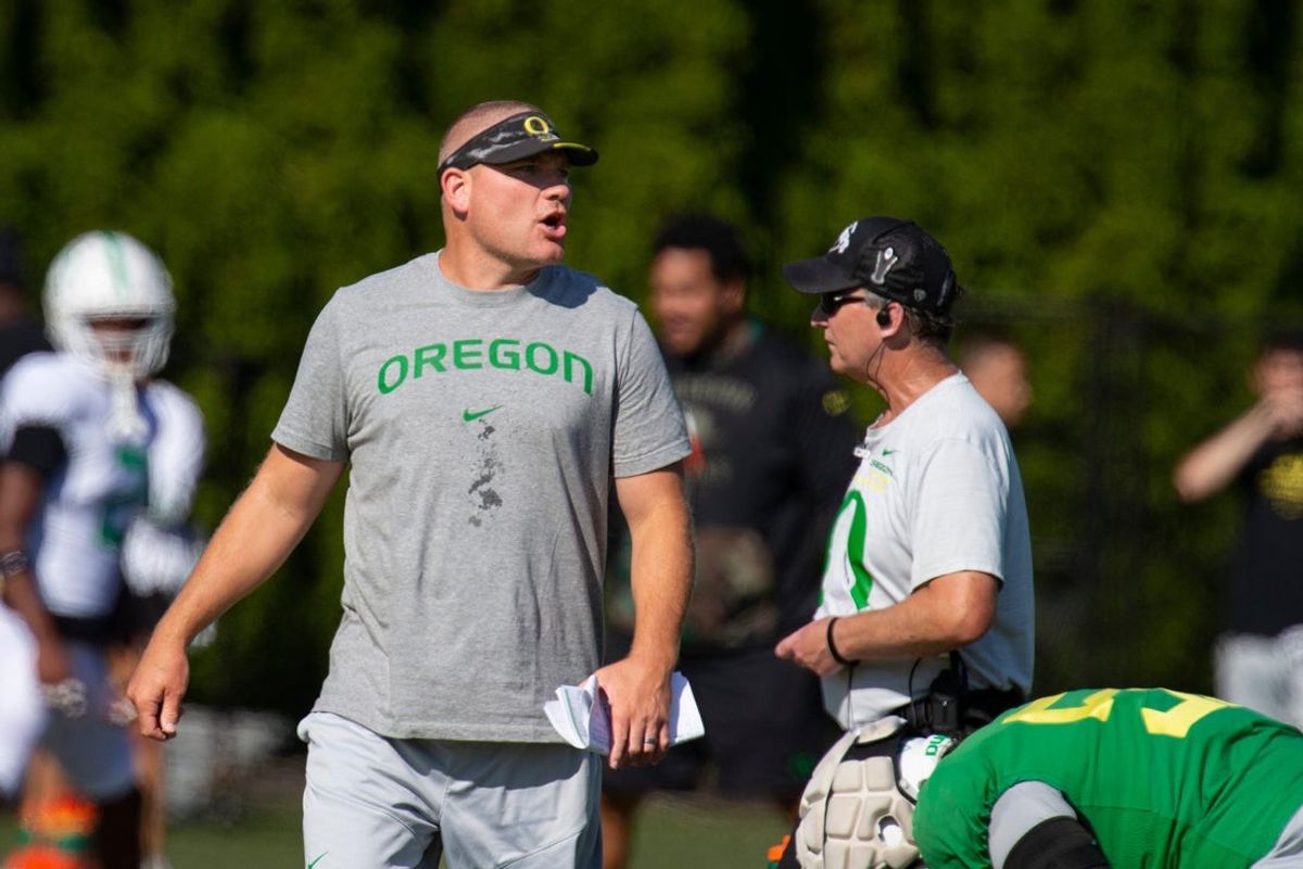 Oregon defensive coordinator Tosh Lupoi watches practice Wednesday Aug. 24, 2022 in Eugene, Ore.
