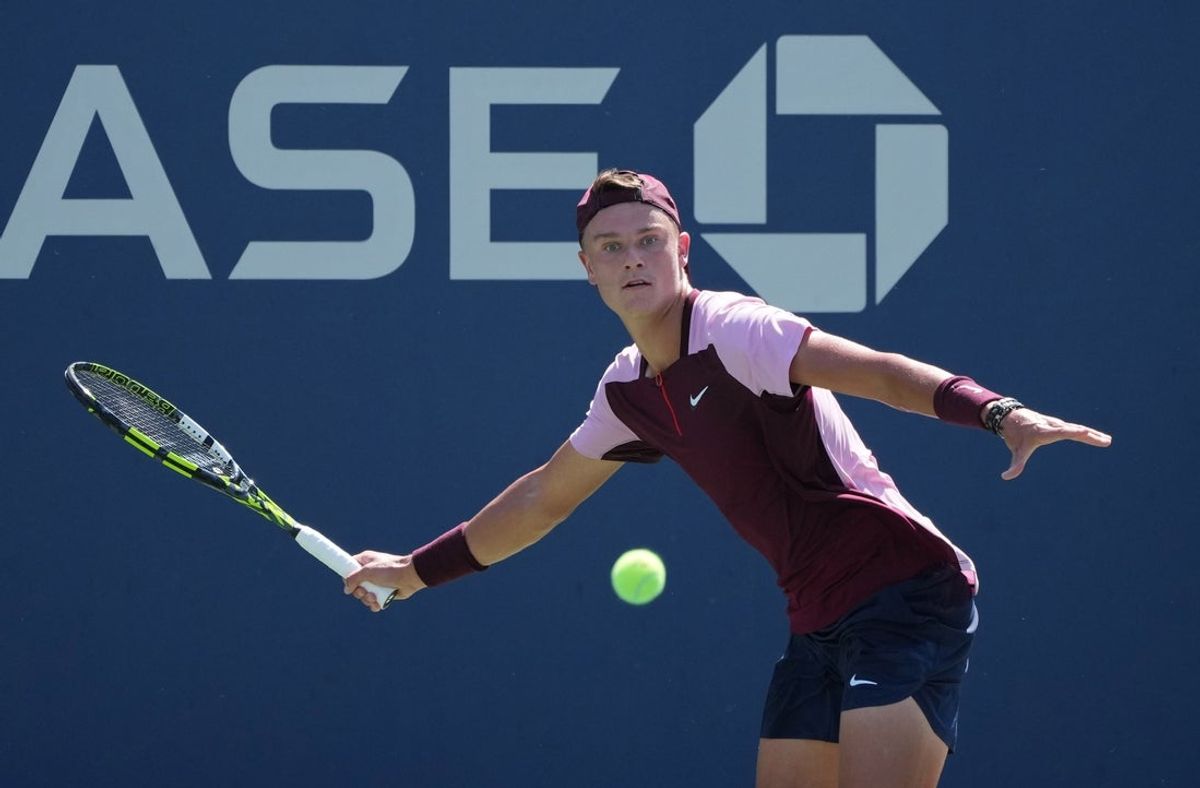 Aug 30, 2022; Flushing, NY, USA; Holger Rune of Denmark hits a shot against Peter Gojowczyk of Germany on day two of the 2022 U.S. Open tennis tournament at USTA Billie Jean King National Tennis Center. Mandatory Credit: Jerry Lai-Imagn Images