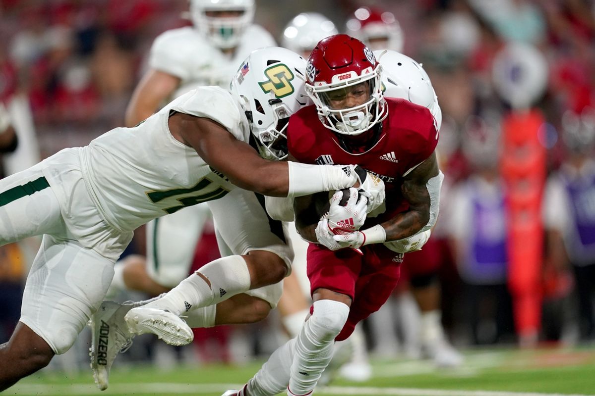 Sep 1, 2022; Fresno, California, USA; Fresno State Bulldogs wide receiver Jalen Moreno-Cropper (5) is tackled by Cal Poly Mustangs defensive lineman Elijah Ponder (14) after making a catch in the third quarter at Valley Children's Stadium. Mandatory Credit: Cary Edmondson-Imagn Images