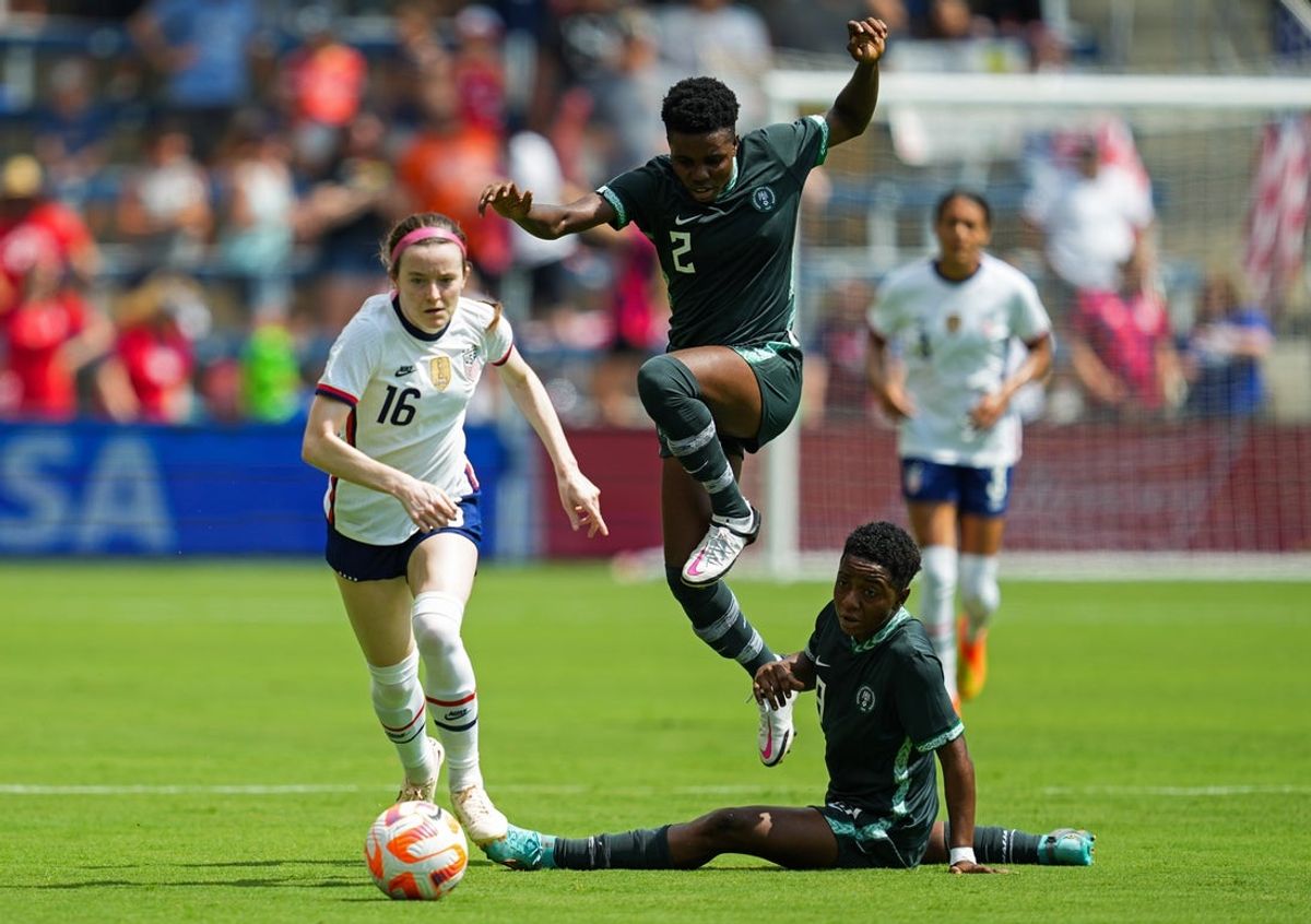 Sep 3, 2022; Kansas City, Kansas, USA; United States midfielder Rose Lavelle (16) controls the ball past Nigeria forward Gift Monday (2) and forward Ifeoma Onumonu (9) during the first half at Children s Mercy Park. Mandatory Credit: Jay Biggerstaff-Imagn Images