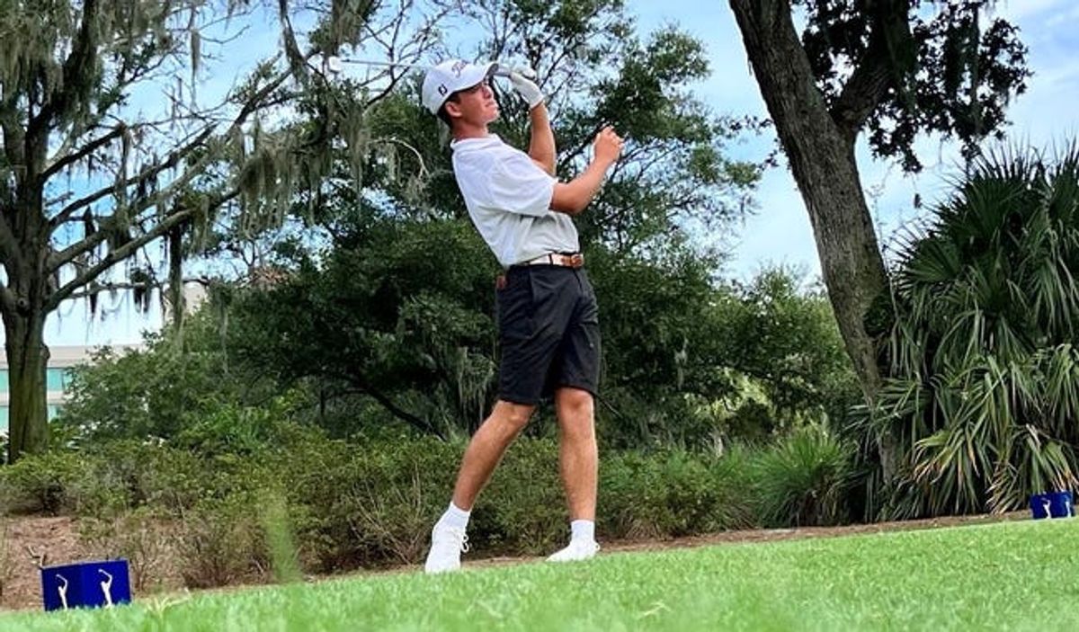 Jackson Koivun of Chapel Hill, N.C., watches his tee shot at the par-3 13th hole of the TPC Sawgrass Players Stadium Course during Sunday's final round of the Junior Players Championship.

Koivun On 13