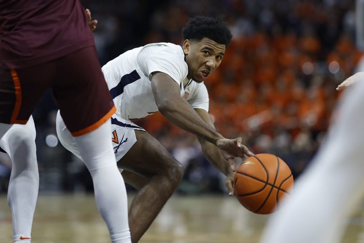 Jan 17, 2024; Charlottesville, Virginia, USA; Virginia Cavaliers guard Reece Beekman (2) passes the ball against the Virginia Tech Hokies in the second half at John Paul Jones Arena.