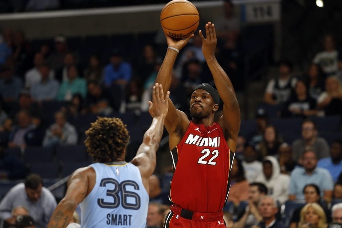 Nov 8, 2023; Memphis, Tennessee, USA; Miami Heat forward Jimmy Butler (22) shoots for three during the first half against the Memphis Grizzlies at FedExForum.