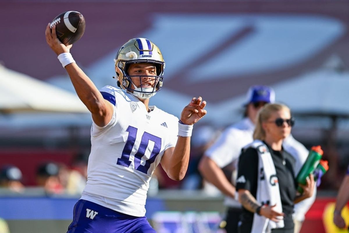 Nov 4, 2023; Los Angeles, California, USA; Washington Huskies quarterback Austin Mack (10) throws a pass against the USC Trojans during warmups at United Airlines Field at Los Angeles Memorial Coliseum.