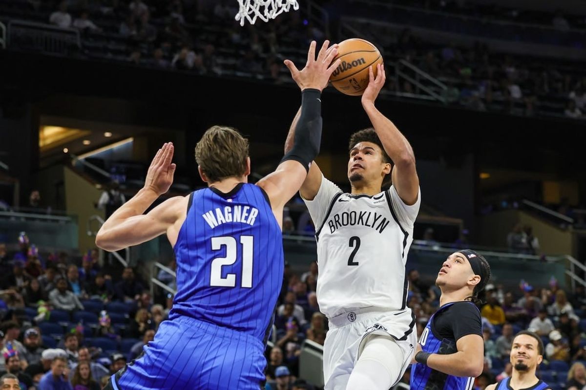 Feb 27, 2024; Orlando, Florida, USA; Brooklyn Nets forward Cameron Johnson (2) goes to the basket against Orlando Magic center Moritz Wagner (21) during the second half at Amway Center.