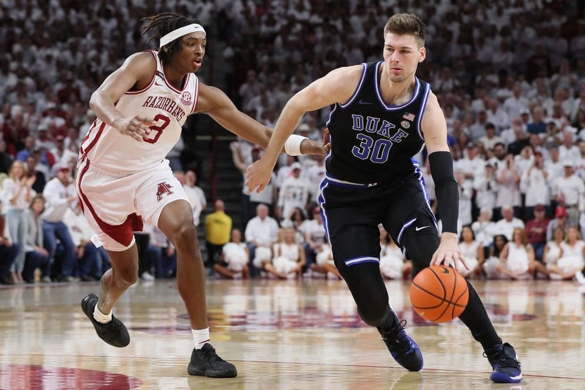 Nov 29, 2023; Fayetteville, Arkansas, USA; Duke Blue Devils center Kyle Filipowski (30) during the first half as Arkansas Razorbacks Chandler Lawson (8) defends at Bud Walton Arena. Arkansas won 80-75.