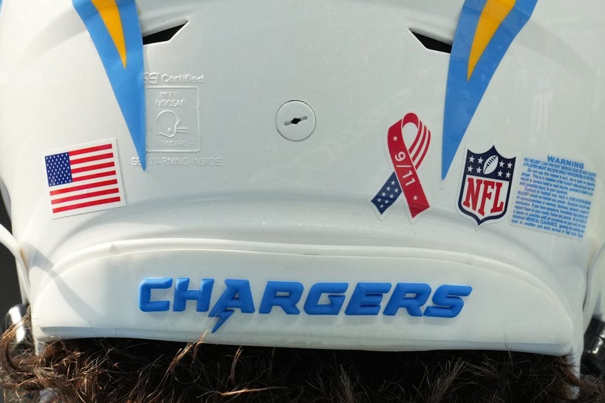 Sep 11, 2022; Inglewood, California, USA; A detailed view of the 9/11 ribbon logo on the back of the helmet of Los Angeles Chargers quarterback Justin Herbert (10) during the game against the Las Vegas Raiders at SoFi Stadium. Mandatory Credit: Kirby Lee-Imagn Images