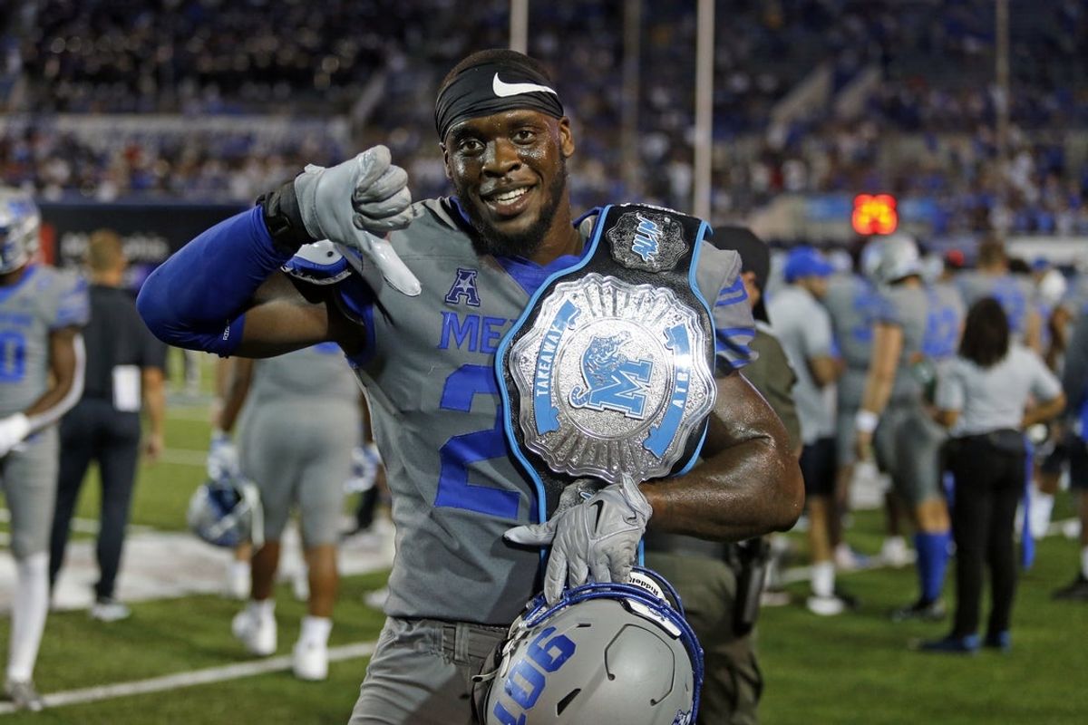 Sep 17, 2022; Memphis, Tennessee, USA; Memphis Tigers defensive linemen Jaylon Allen (22) shows off the takeaway belt during the second half against the Arkansas State Red Wolves at Liberty Bowl Memorial Stadium. Mandatory Credit: Petre Thomas-Imagn Images