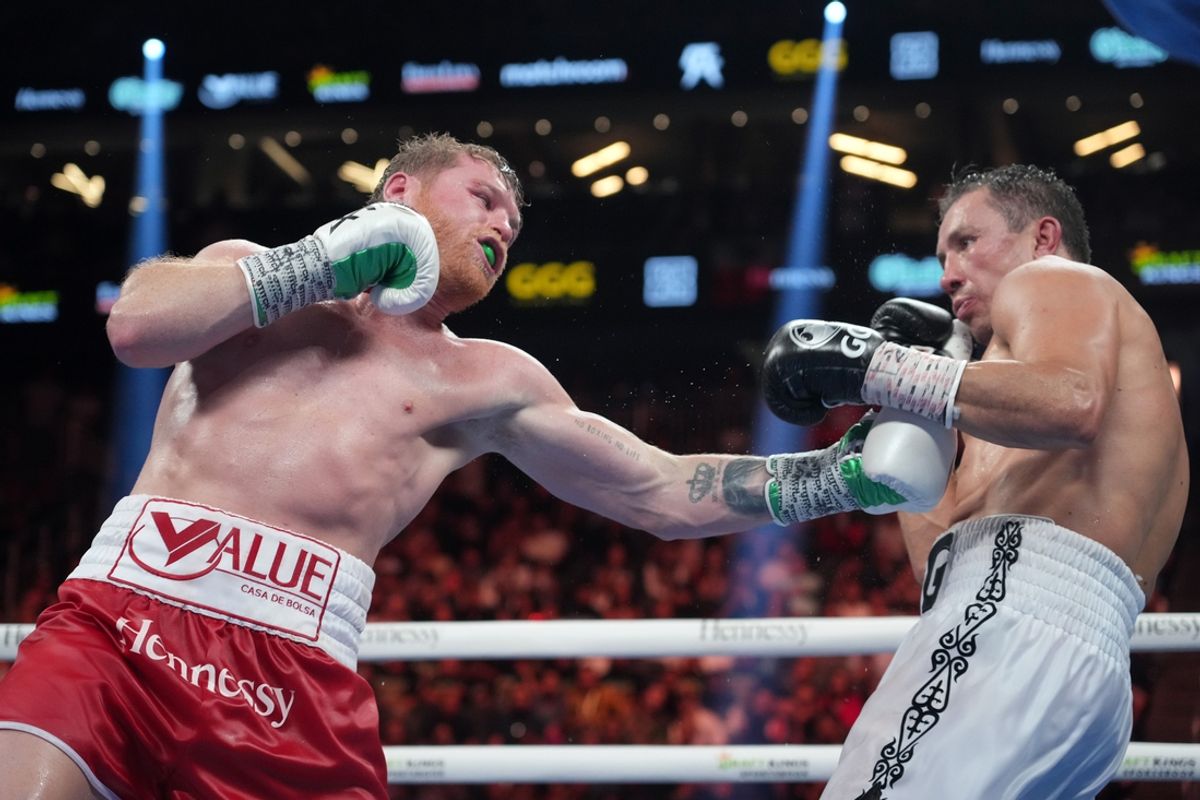 Sep 17, 2022; Las Vegas, Nevada, USA; Canelo Alvarez (red trunks) and Gennadiy Golovkin (white trunks) box during a super middleweight championship bout at T-Mobile Arena. Mandatory Credit: Joe Camporeale-Imagn Images