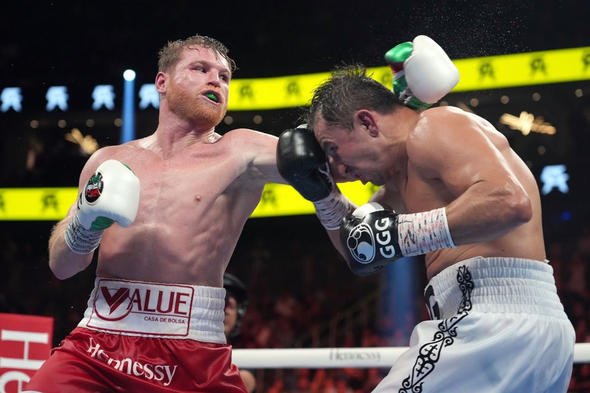 Sep 17, 2022; Las Vegas, Nevada, USA; Canelo Alvarez (red trunks) and Gennadiy Golovkin (white trunks) box during a super middleweight championship bout at T-Mobile Arena. Mandatory Credit: Joe Camporeale-Imagn Images
