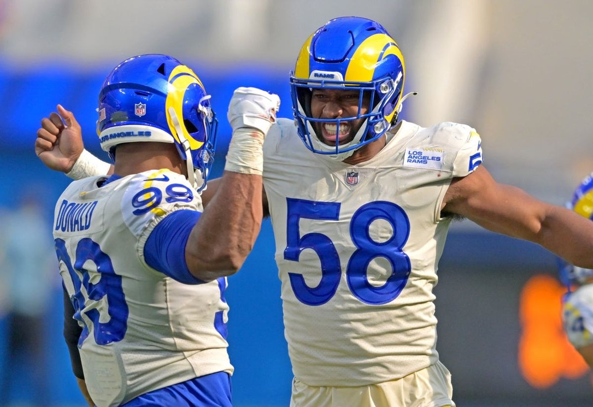 Sep 18, 2022; Inglewood, California, USA;  Los Angeles Rams linebacker Justin Hollins (58) is congratulated by defensive tackle Aaron Donald (99) after a sack of Atlanta Falcons quarterback Marcus Mariota (1) in the fourth quarter at SoFi Stadium. Mandatory Credit: Jayne Kamin-Oncea-Imagn Images