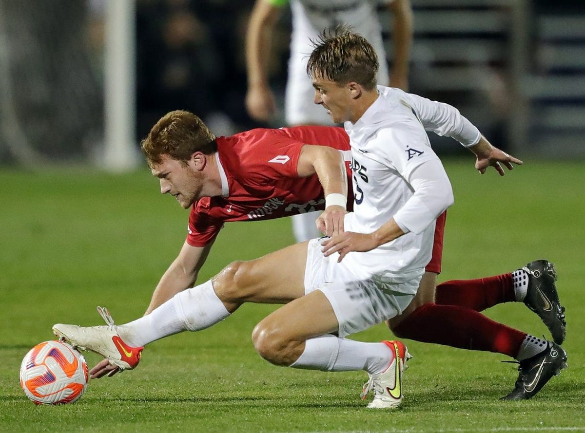 Akron forward Jason Shokalook (9) battles for the ball against Duquesne midfielder Logan Muck (29) during the first half of an NCAA soccer match, Wednesday, Sept. 28, 2022, in Akron, Ohio.

Zipsduqesnemsoc 5
