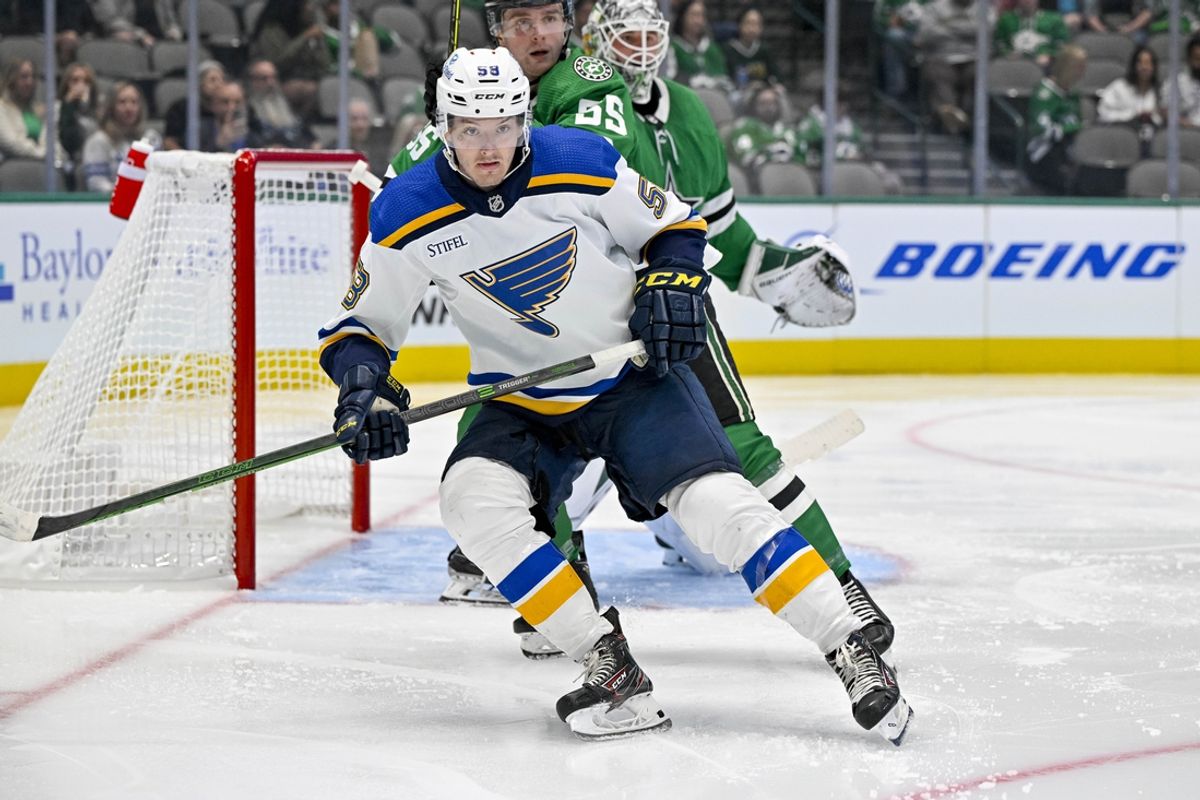 Sep 26, 2022; Dallas, Texas, USA; St. Louis Blues right wing Mathias Laferriere (58) in action during the game between the Dallas Stars and the St. Louis Blues at American Airlines Center. Mandatory Credit: Jerome Miron-Imagn Images