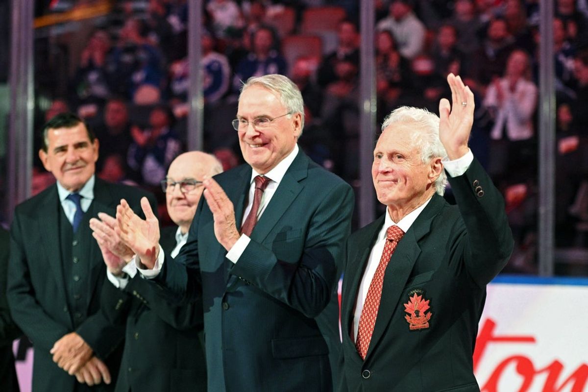(EDITORS NOTE: caption correction) Sep 28, 2022; Toronto, Ontario, CAN; Former NHL and Team Canada player Paul Henderson waves as he is applauded by team mates (from right) Ken Dryden, Ron Ellis and Serge Savard during a ceremony to honor members of the team that played in the 1972 Summit Series against the Soviet Union before the start of the Montreal Canadiens at Toronto Maple Leafs game at Scotiabank Arena. Mandatory Credit: Dan Hamilton-Imagn Images