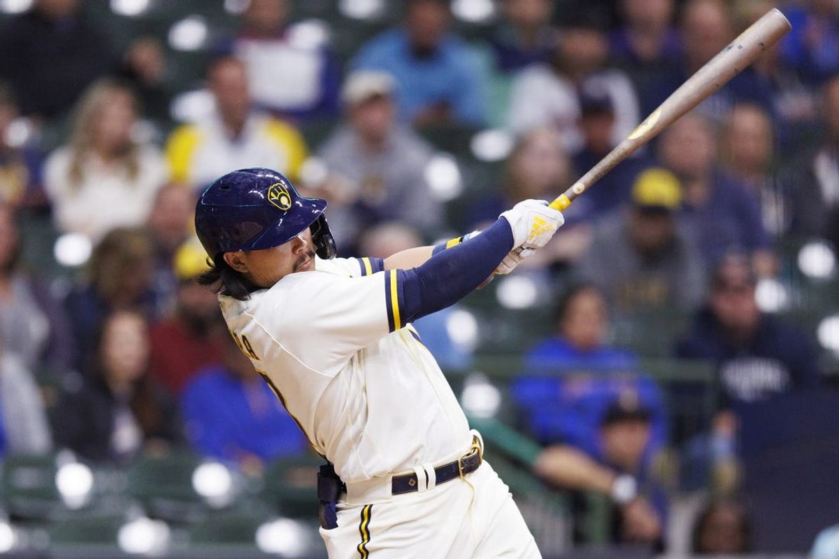Sep 29, 2022; Milwaukee, Wisconsin, USA;  Milwaukee Brewers first baseman Keston Hiura (18) hits an RBI double during the second inning against the Miami Marlins at American Family Field. Mandatory Credit: Jeff Hanisch-USA TODAY Sports