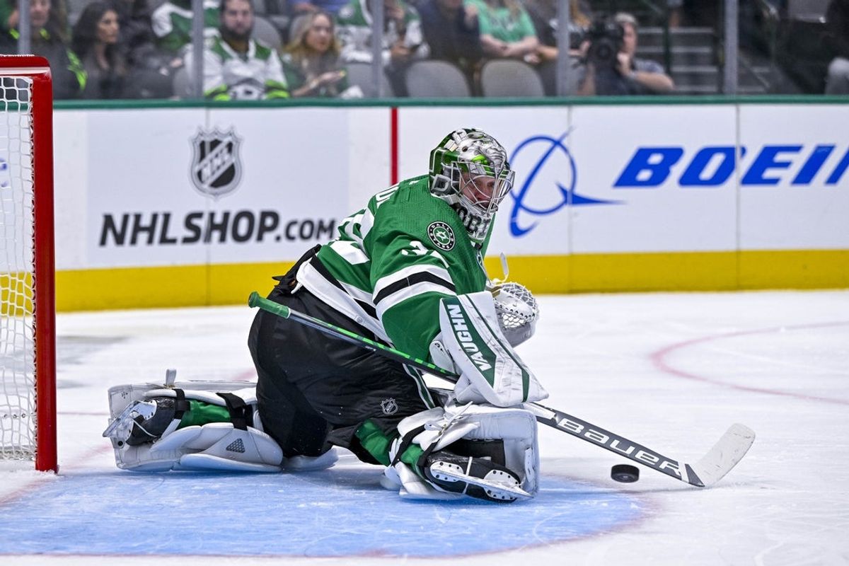 Sep 29, 2022; Dallas, Texas, USA; Dallas Stars goaltender Anton Khudobin (35) makes a stick save on a Minnesota Wild shot during the first period at the American Airlines Center. Mandatory Credit: Jerome Miron-Imagn Images