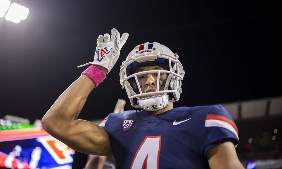 Oct 1, 2022; Tucson, Arizona, USA; Arizona Wildcats wide receiver Tetairoa McMillan (4) celebrates after scoring a touchdown against the Colorado Buffaloes in the first half at Arizona Stadium. Mandatory Credit: Ivan Pierre Aguirre-Imagn Images