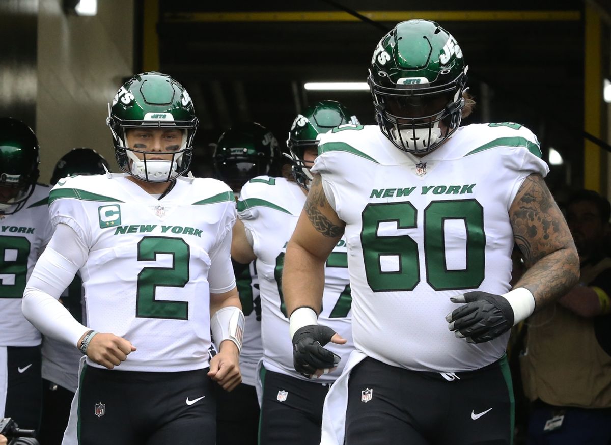 Oct 2, 2022; Pittsburgh, Pennsylvania, USA;  New York Jets quarterback Zach Wilson (2) and center Connor McGovern (60) take the field to warm up before the game against the Pittsburgh Steelers at Acrisure Stadium. Mandatory Credit: Charles LeClaire-Imagn Images