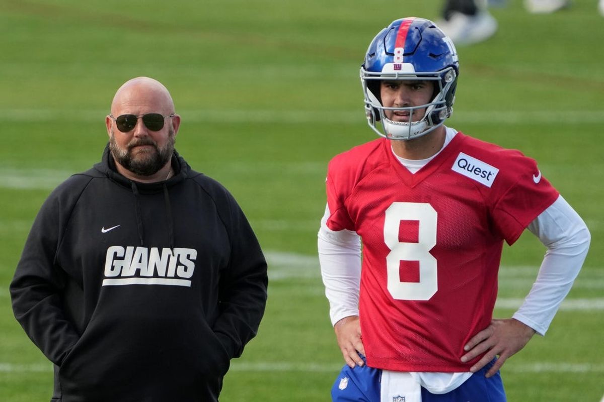 Oct 7,, 2022; Thundridge, United Kingdom; New York Giants head coach Brian Daboll (left) and quarterback Daniel Jones (8) react during practice at Hanbury Manor. Mandatory Credit: Kirby Lee-USA TODAY Sports