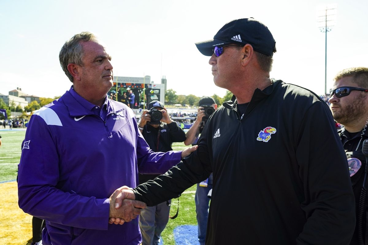 Oct 8, 2022; Lawrence, Kansas, USA; TCU Horned Frogs head coach Sonny Dykes shakes hands with Kansas Jayhawks head coach Lance Leipold after a game at David Booth Kansas Memorial Stadium. Mandatory Credit: Jay Biggerstaff-Imagn Images