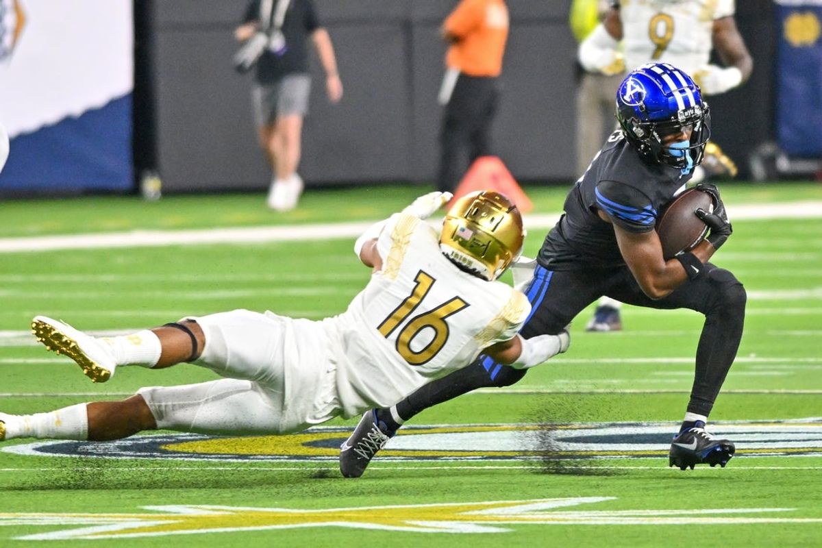 Oct 8, 2022; Paradise, Nevada, USA; Notre Dame Fighting Irish safety Brandon Joseph (16) attempts to tackle BYU Cougars wide receiver Kody Epps (0) in the fourth quarter at Allegiant Stadium. Mandatory Credit: Matt Cashore-Imagn Images