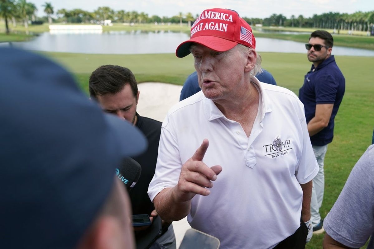 Oct 27, 2022; Miami, Florida, USA; Former President Donald Trump speaks with the media following his round during the Pro-Am tournament before the LIV Golf series at Trump National Doral. Mandatory Credit: Jasen Vinlove-Imagn Images