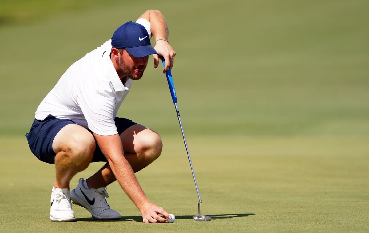 Oct 29, 2022; Miami, Florida, USA; Sam Horsfield lines up his putt for the 17th green during the second round of the season finale of the LIV Golf series at Trump National Doral. Mandatory Credit: John David Mercer-Imagn Images