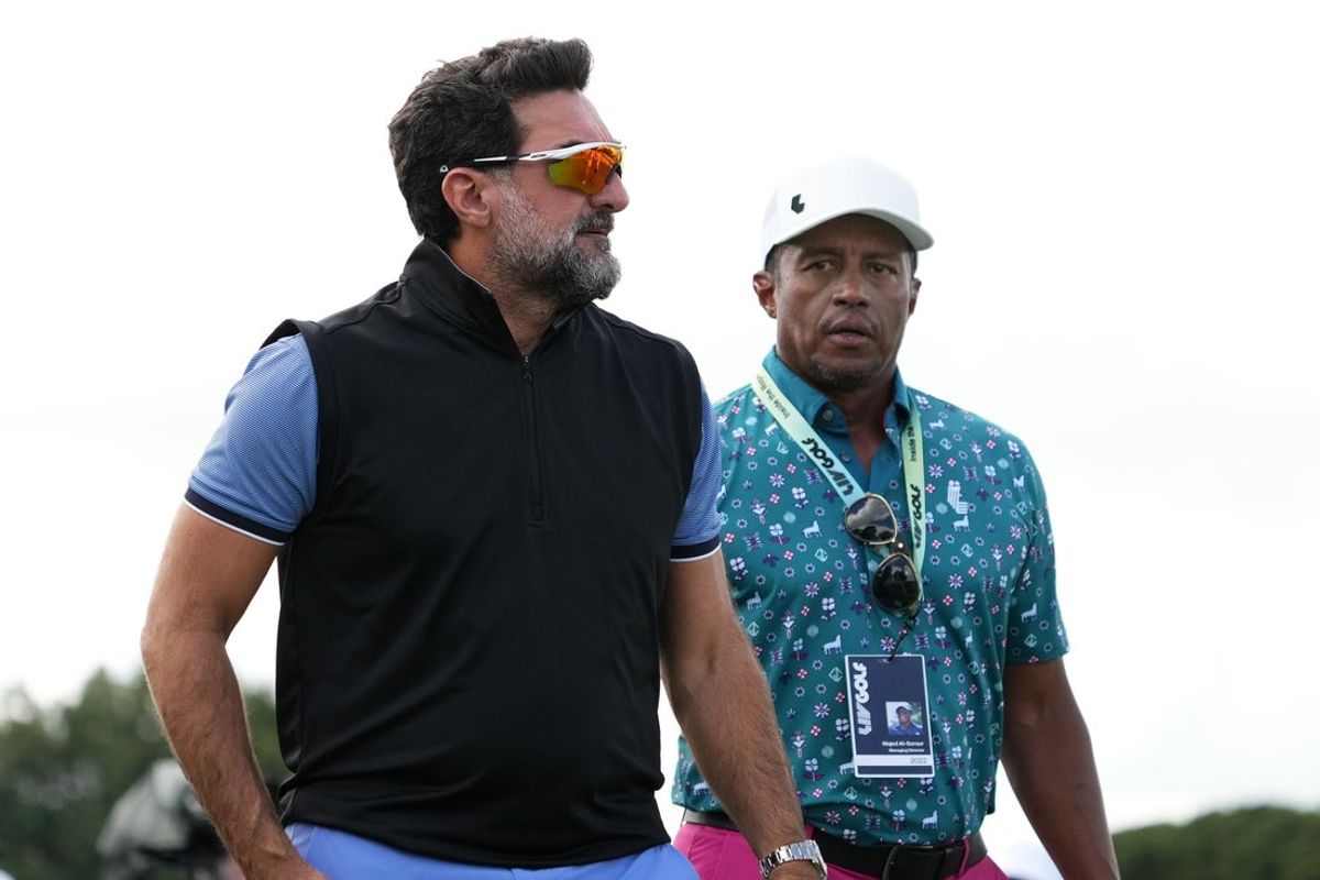Oct 29, 2022; Miami, Florida, USA; Yasir Al-Rumayyan (L) walks next to Saudi golf CEO Majed Al Surour (R) during the second round of the season finale of the LIV Golf series at Trump National Doral. Mandatory Credit: Jasen Vinlove-Imagn Images
