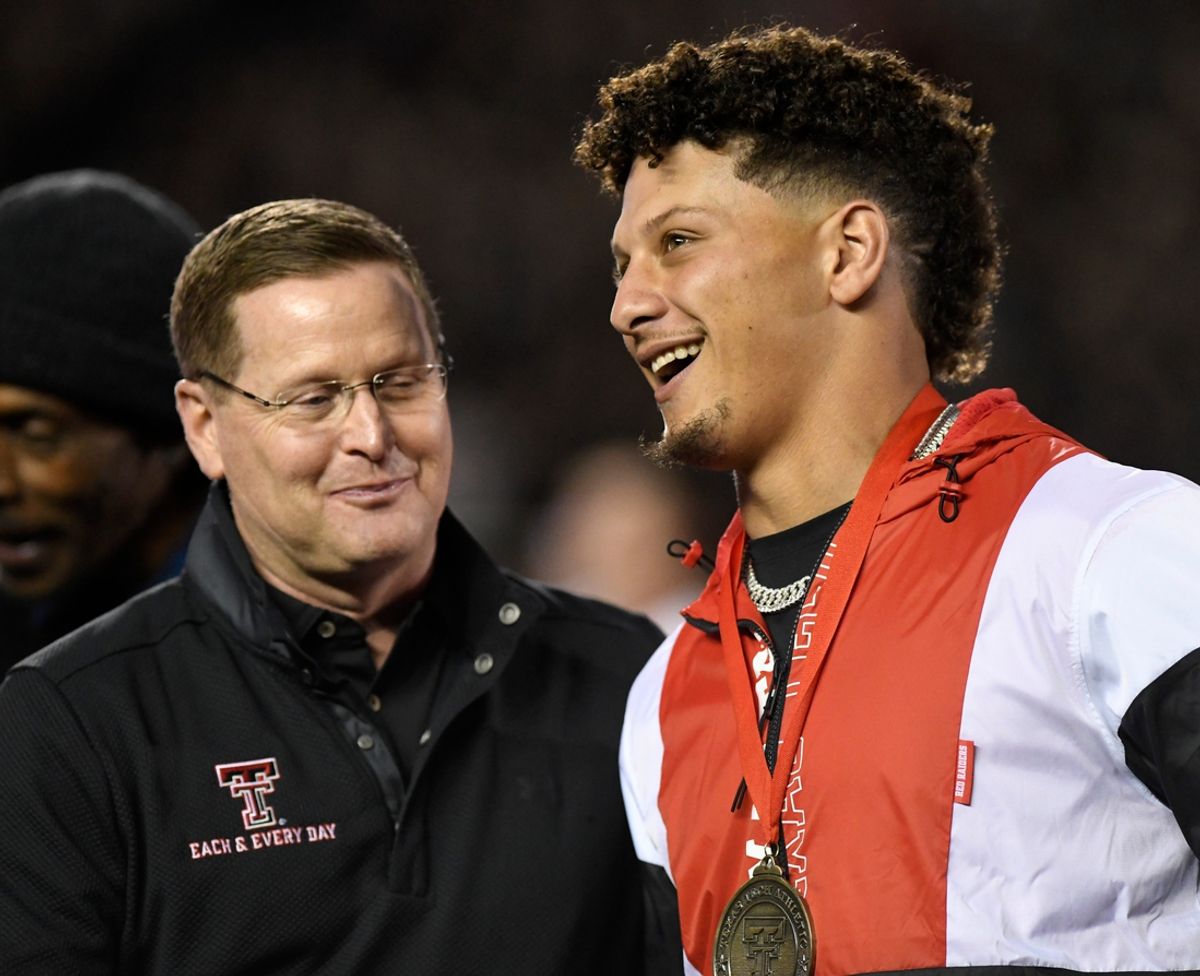 Texas Tech athletic directory Kirby Holcutt stands next to Patrick Mahomes during his Ring of Honor ceremony, Saturday, Oct. 29, 2022, at Jones AT&T Stadium.