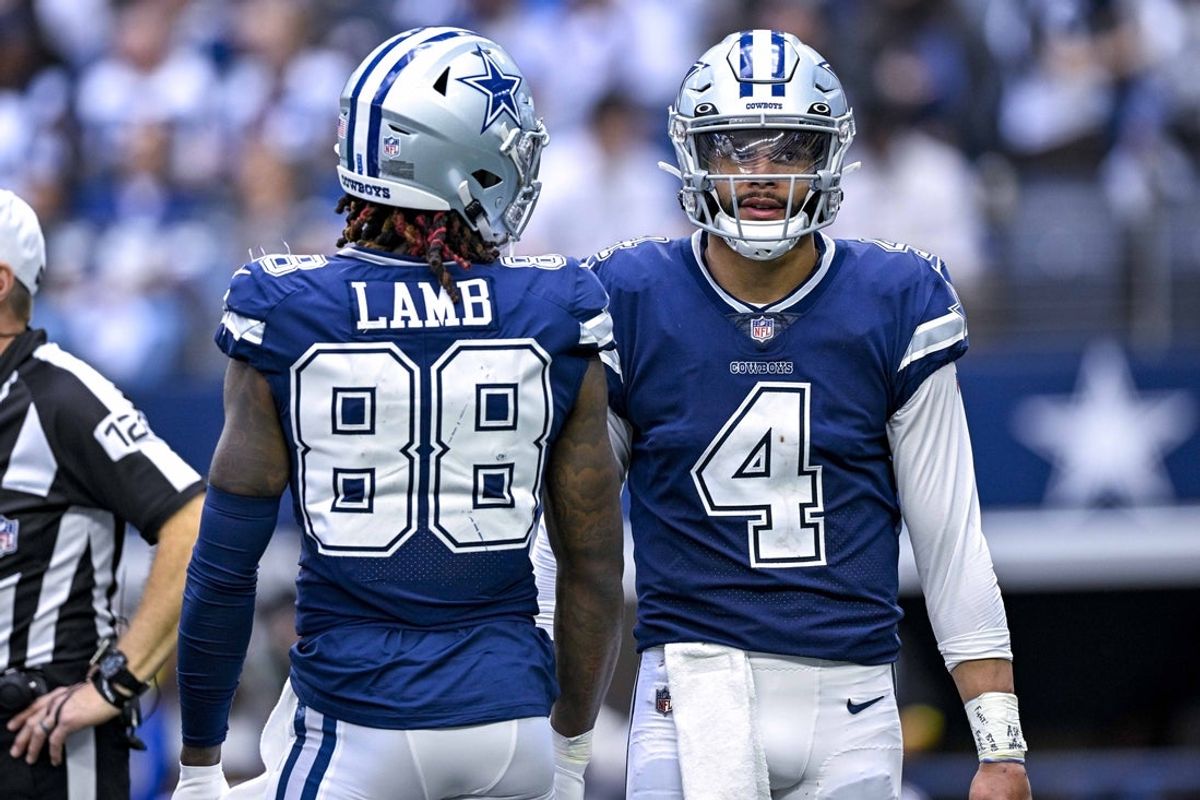 Oct 30, 2022; Arlington, Texas, USA; Dallas Cowboys wide receiver CeeDee Lamb (88) and quarterback Dak Prescott (4) wait for play to resume against the Chicago Bears during the second half at AT&T Stadium. Mandatory Credit: Jerome Miron-Imagn Images