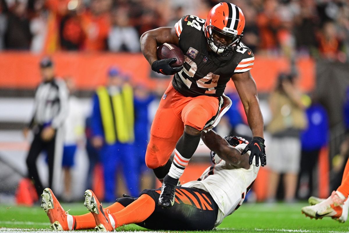 Oct 31, 2022; Cleveland, Ohio, USA; Cleveland Browns running back Nick Chubb (24) steps over Cincinnati Bengals linebacker Germaine Pratt (57) after scoring a touchdown in the fourth quarter at FirstEnergy Stadium. Mandatory Credit: David Dermer-Imagn Images