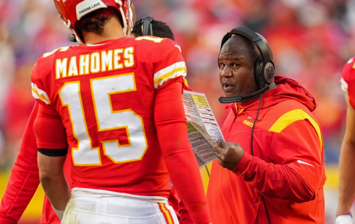Oct 16, 2022; Kansas City, Missouri, USA; Kansas City Chiefs offensive coordinator Eric Bieniemy talks with quarterback Patrick Mahomes (15) during the second half against the Buffalo Bills at GEHA Field at Arrowhead Stadium. Mandatory Credit: Jay Biggerstaff-Imagn Images