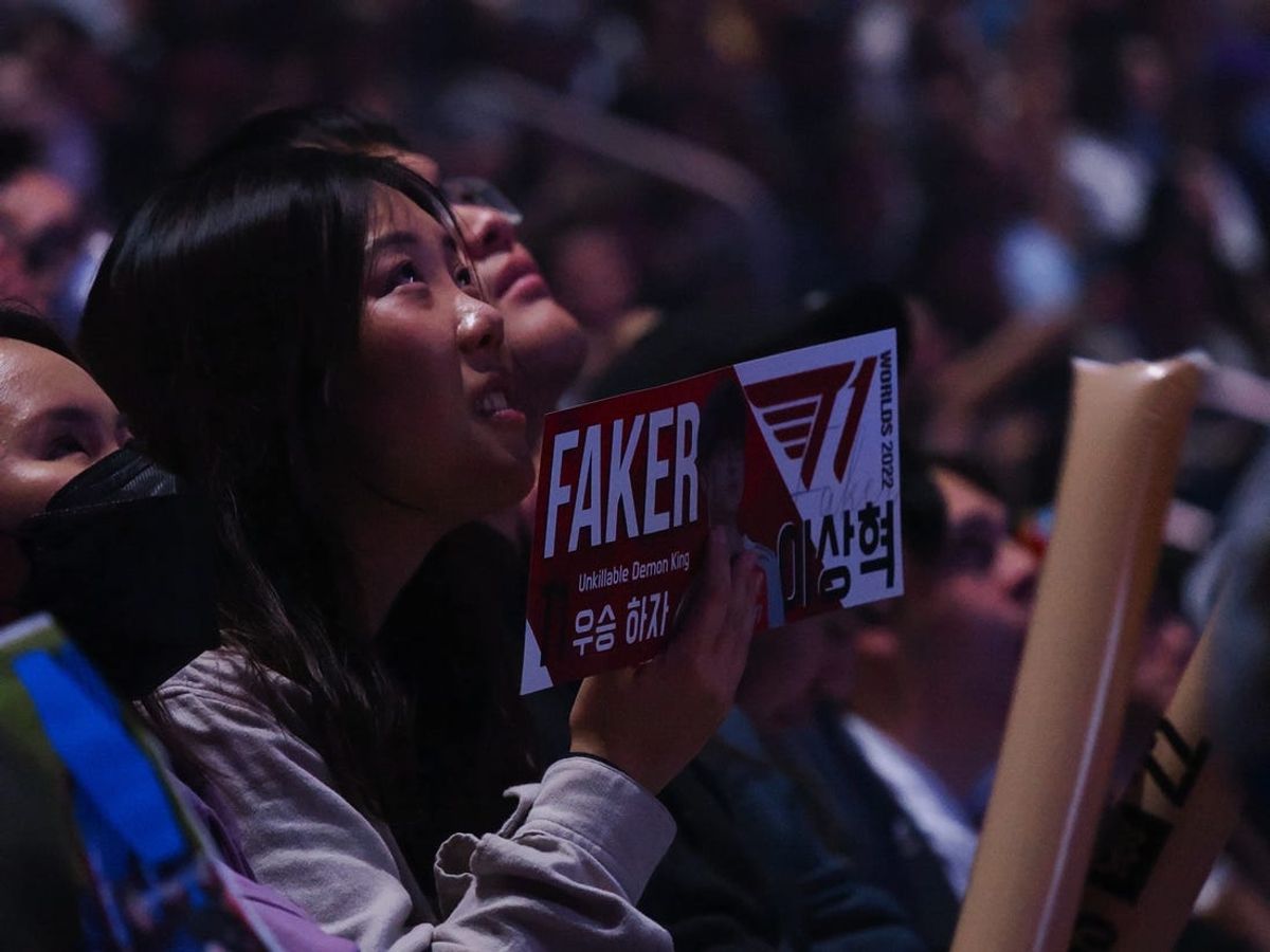 Nov 5, 2022; San Francisco, California, USA; A fan holds a sign for T1 mid laner Lee \"Faker\" Sang-hyeok (not pictured) during the League of Legends World Championships agaisnt DRX at Chase Center. Mandatory Credit: Kelley L Cox-USA TODAY Sports