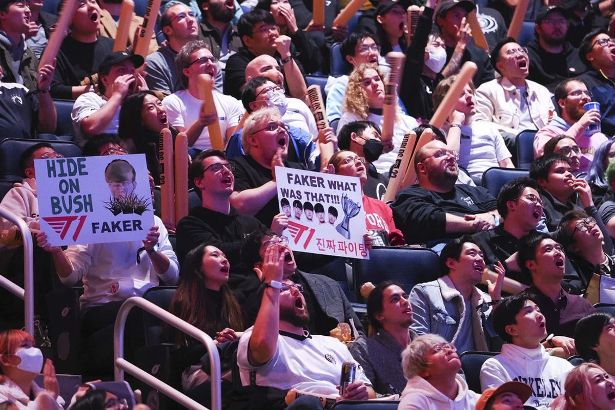 Nov 5, 2022; San Francisco, California, USA; Fans hold signs for T1 mid laner Lee \"Faker\" Sang-hyeok (not pictured) during the League of Legends World Championships against DRX at Chase Center. Mandatory Credit: Kelley L Cox-Imagn Images